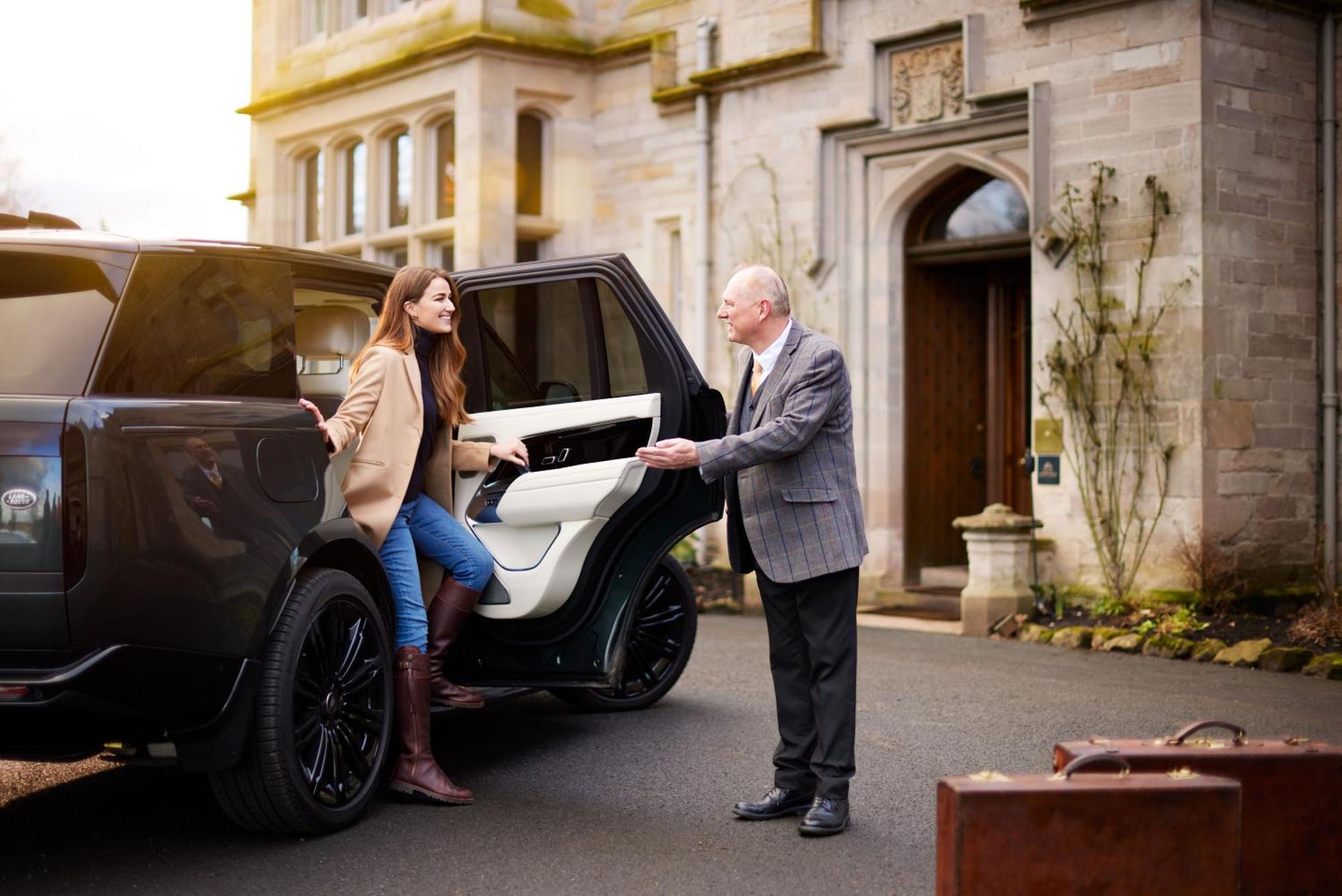 Schloss Roxburghe, Part Of Destination By Hyatt エクステリア 写真 A chauffeur opening the car door for a passenger